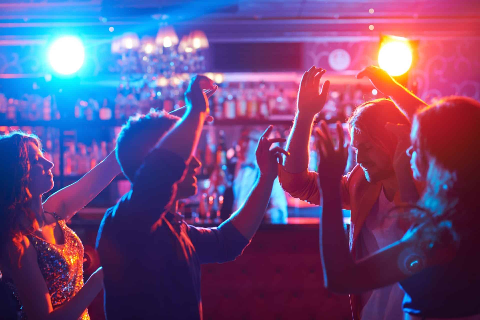 Guests dancing under blue and pink stage lights
