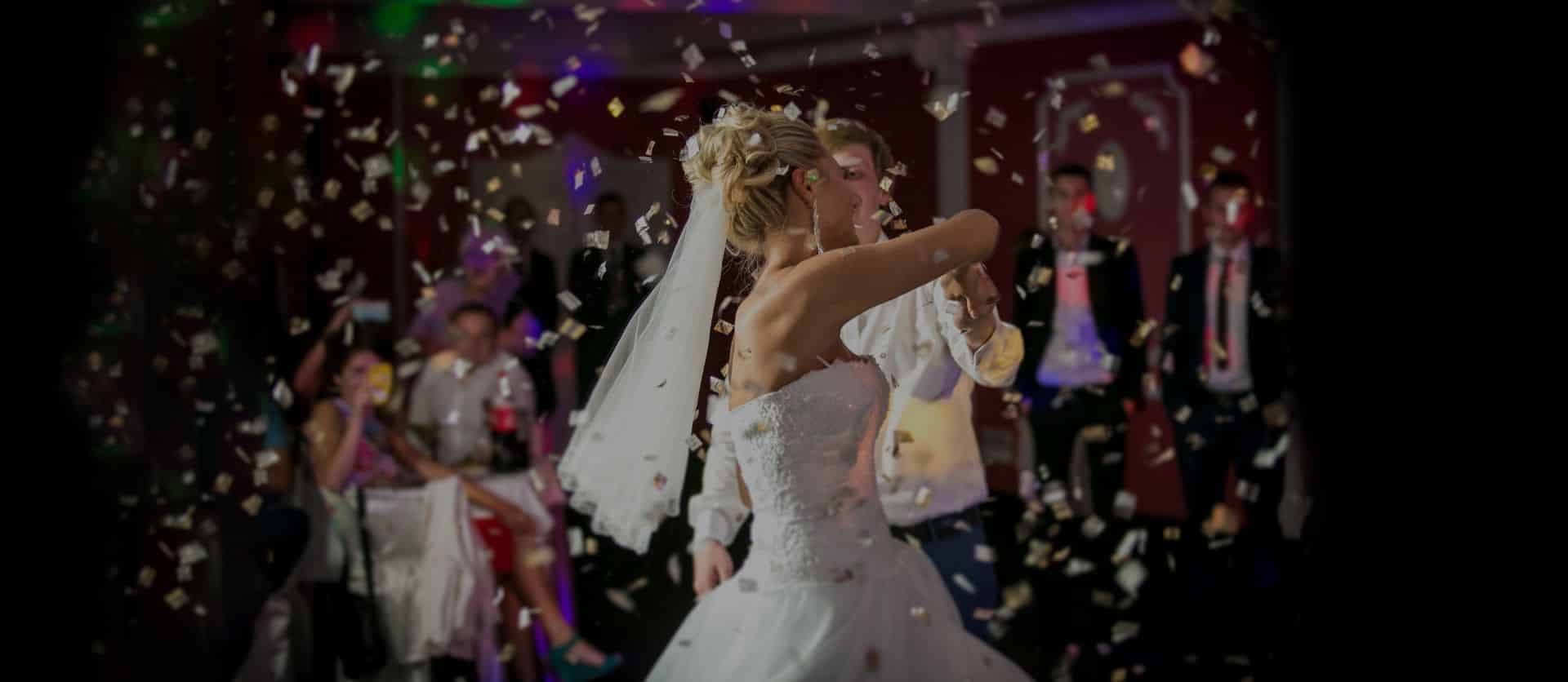 Bride and groom’s first dance in a shower of confetti