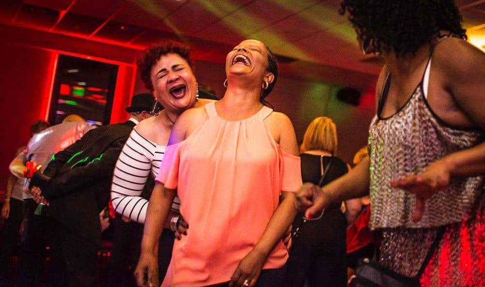 Guests laughing and dancing at a Total Eclipse Disco soul night